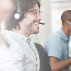 SUPPORT-Business-people-with-headsets-working-at-computers-in-office-1