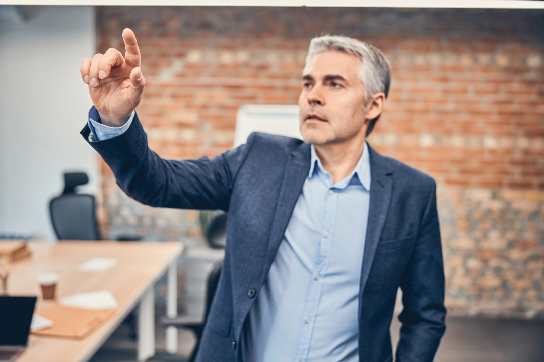 adult-businessman-is-standing-in-his-modern-office