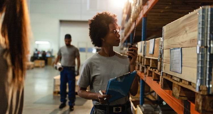 african-american-worker-using-walkie-talkie-while-2023-11-27-05-04-05-utc-1