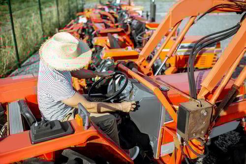 agronomist-choosing-tractor-at-the-agricultural-sh-2025-03-15-15-28-34-utc