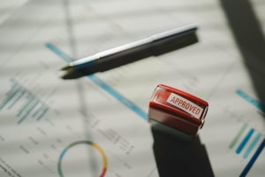 approved-stamp-on-financial-report-with-charts-and-2025-03-09-14-49-21-utc