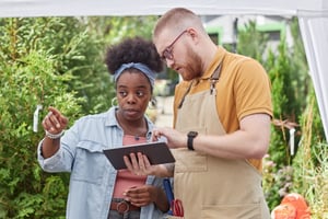 black-female-landscaper-pointing-at-plant-planning-2025-03-08-16-11-02-utc-1