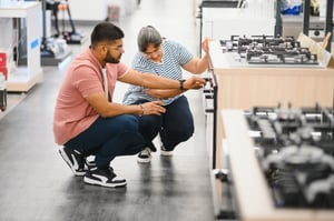 couple-of-young-customers-looking-at-buildin-cooke-2025-03-16-09-13-52-utc-1