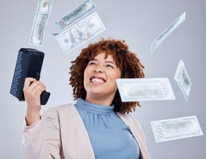 happy-woman-shooting-money