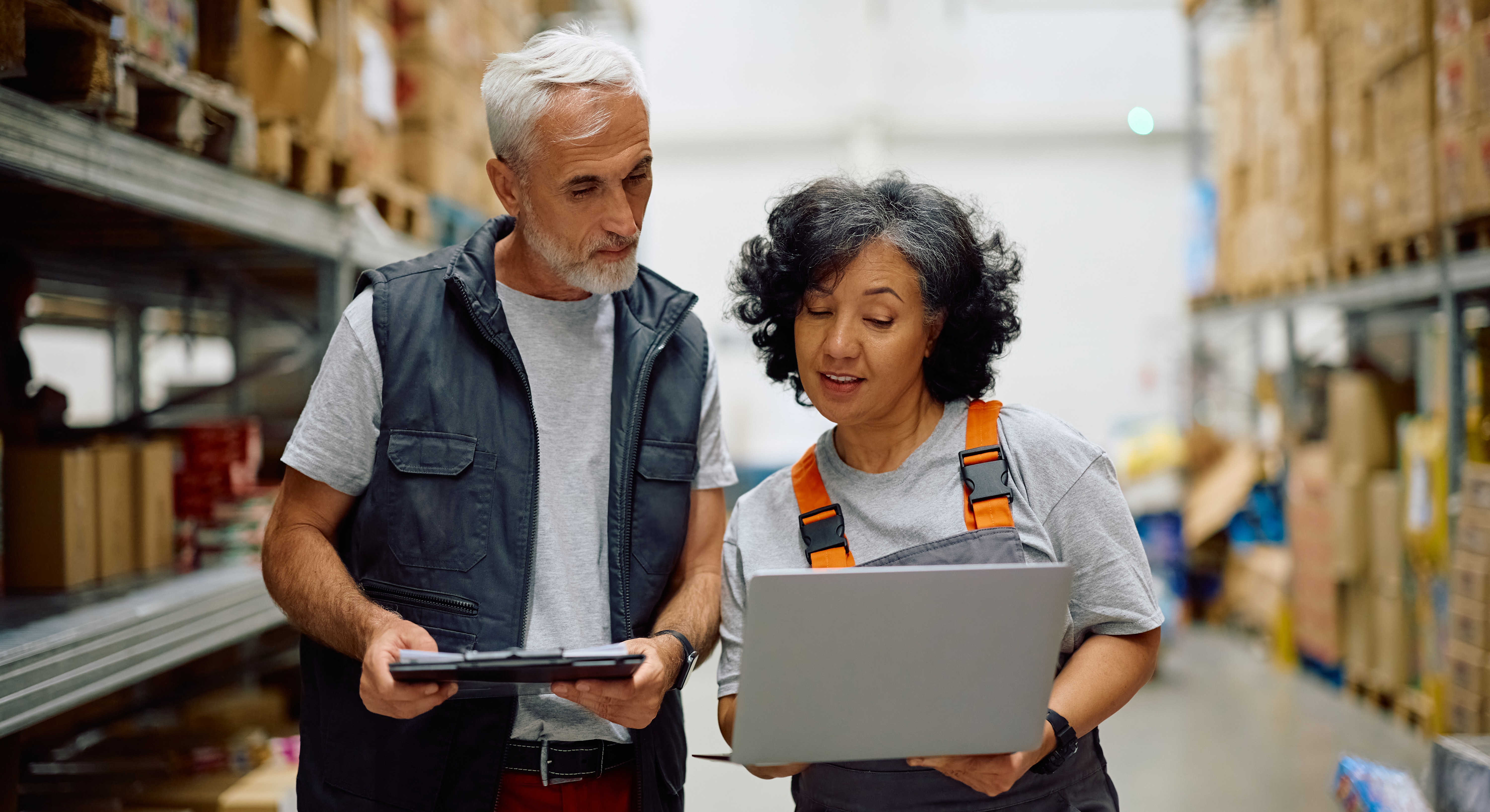 mature-worker-and-her-colleague-working-on-laptop-2025-09-08-16-17-35-utc