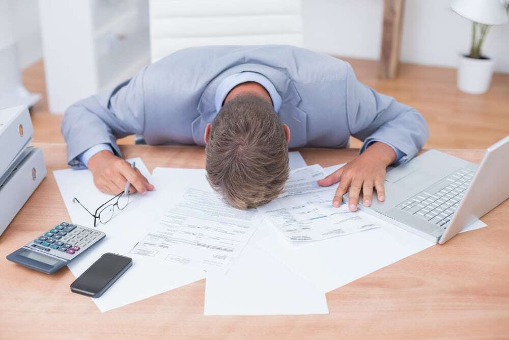 blog.windwardsoftware.comhubfsBusinessman being depressed by accounting in his office-1