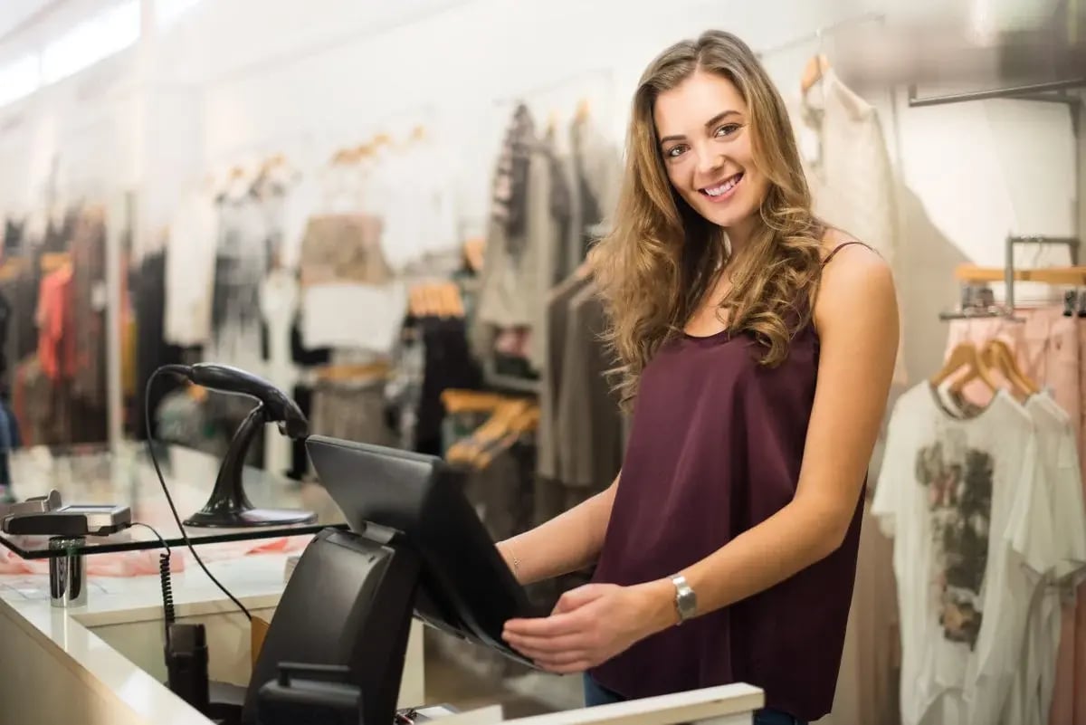 young sales assistant smiling to camera