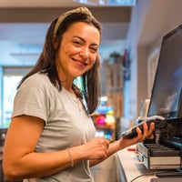 young-woman-taking-payment-at-pos